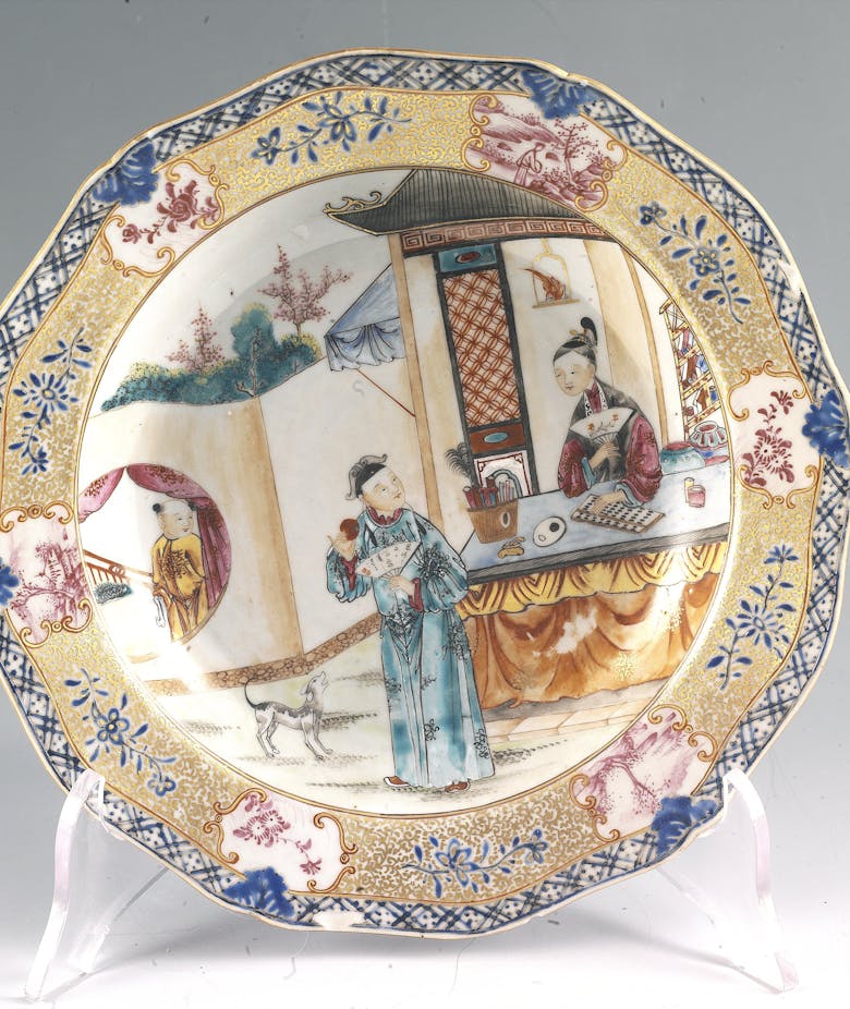 Chinese plate with three figures and a small dog